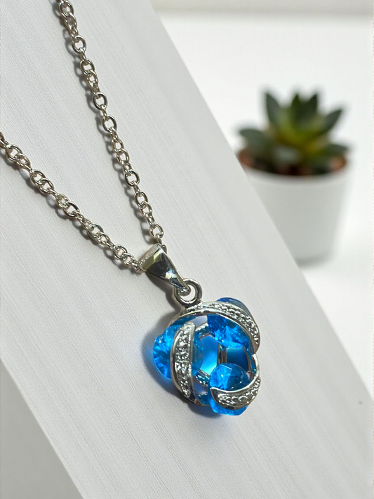 Blue Crystal Swirl Pendant Necklace – Silver Finish